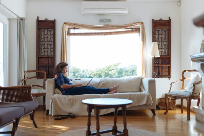 woman sitting on sofa